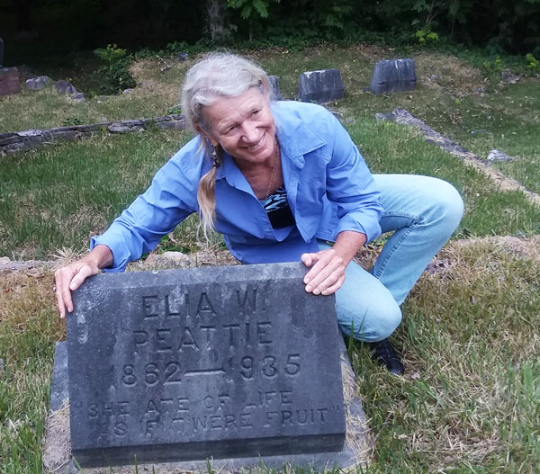 Photo of Peggie Peatie by grave of her great-grandmother Elia